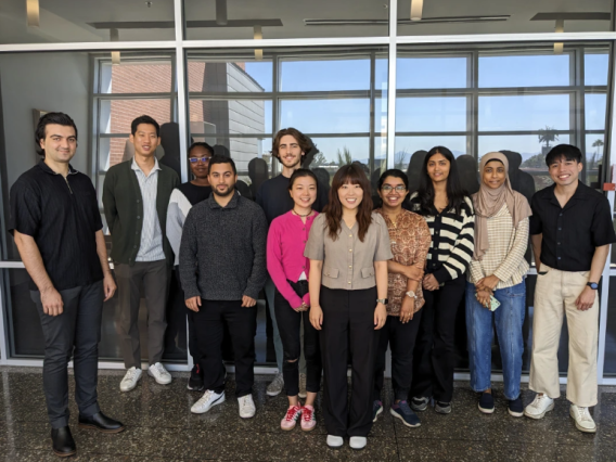 Dr. Chris Lim and students stand for a photo